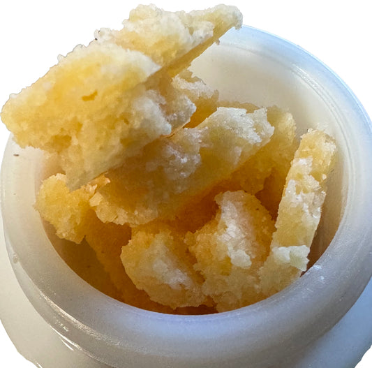 Flakes of crumble concentrate derived from the Warheads hybrid strain: feelings of focus, creativity, and  euphoria.